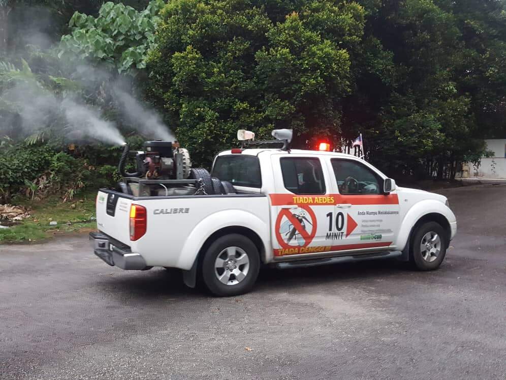 A white truck used by Envirocon for mosquito pest control solution.